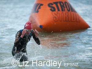 Sophie Corbidge leads from the water